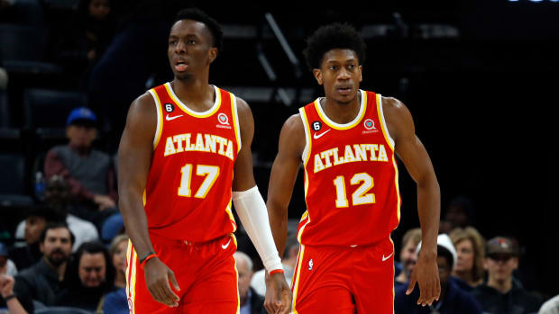 Hawks forwards Onyeka Okongwu and De'Andre Hunter walk up the court.